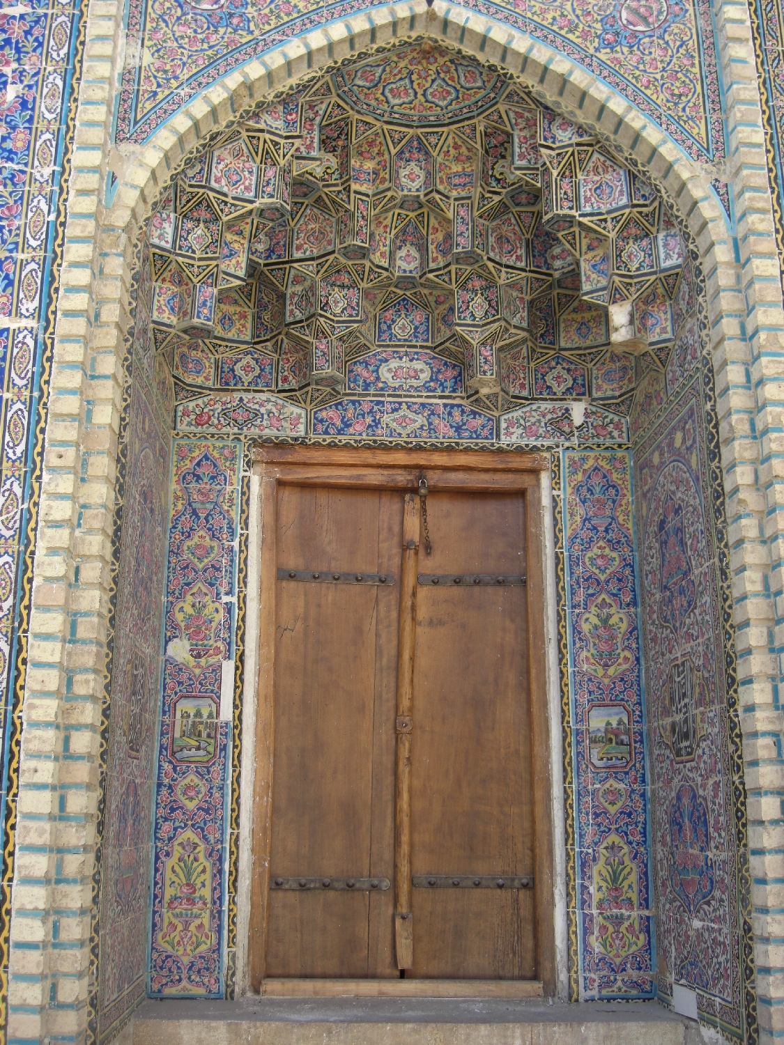 Exterior, entrance door with muqarnas hood
