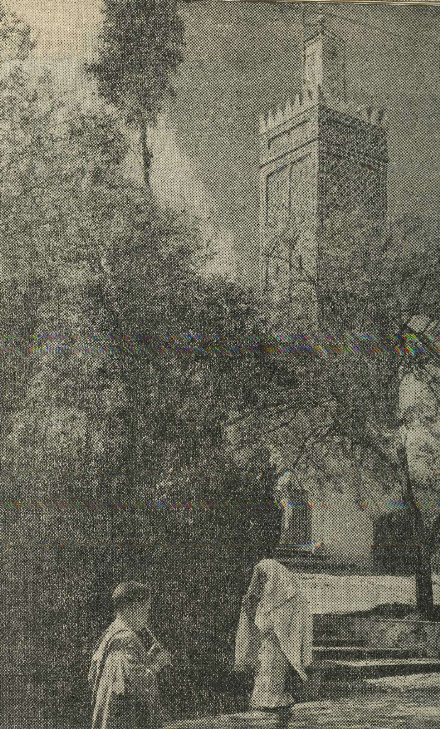 Marshan Mosque and Minaret, covered by trees, figures in foreground