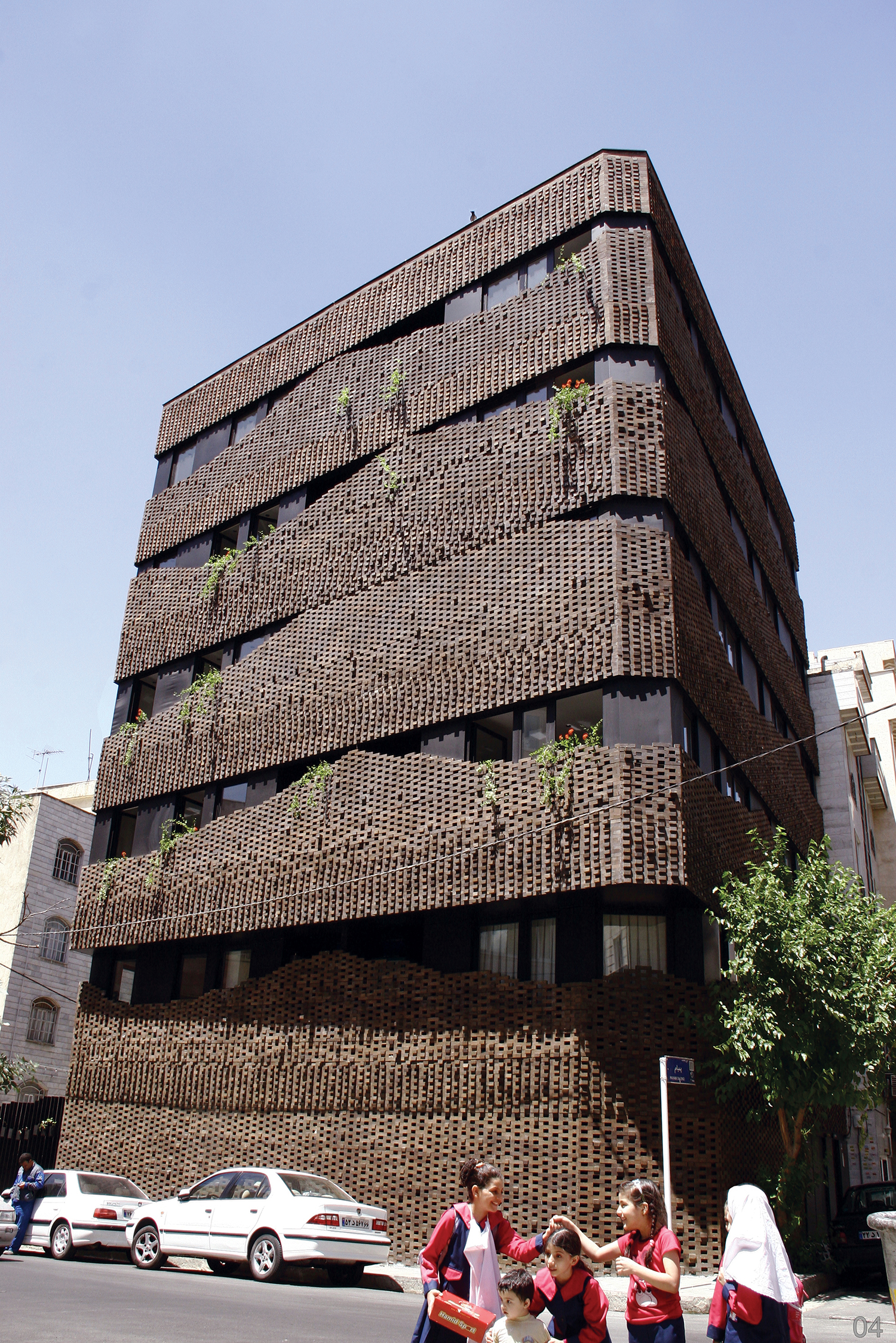 Iranian historic traditions of Persian carpets and building bricks were fused into a contemporary facade that appears as a collection of intricately interwoven modules
