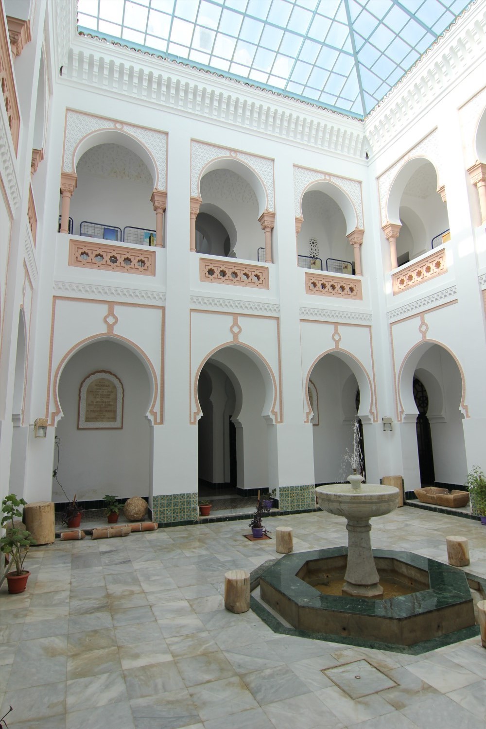 View of the front side of the courtyard, showing marble fountain