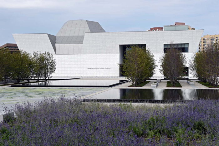 Aga Khan Park, Toronto - Water pools surrounded by gravel with the entrance of the Aga Khan Museum beyond