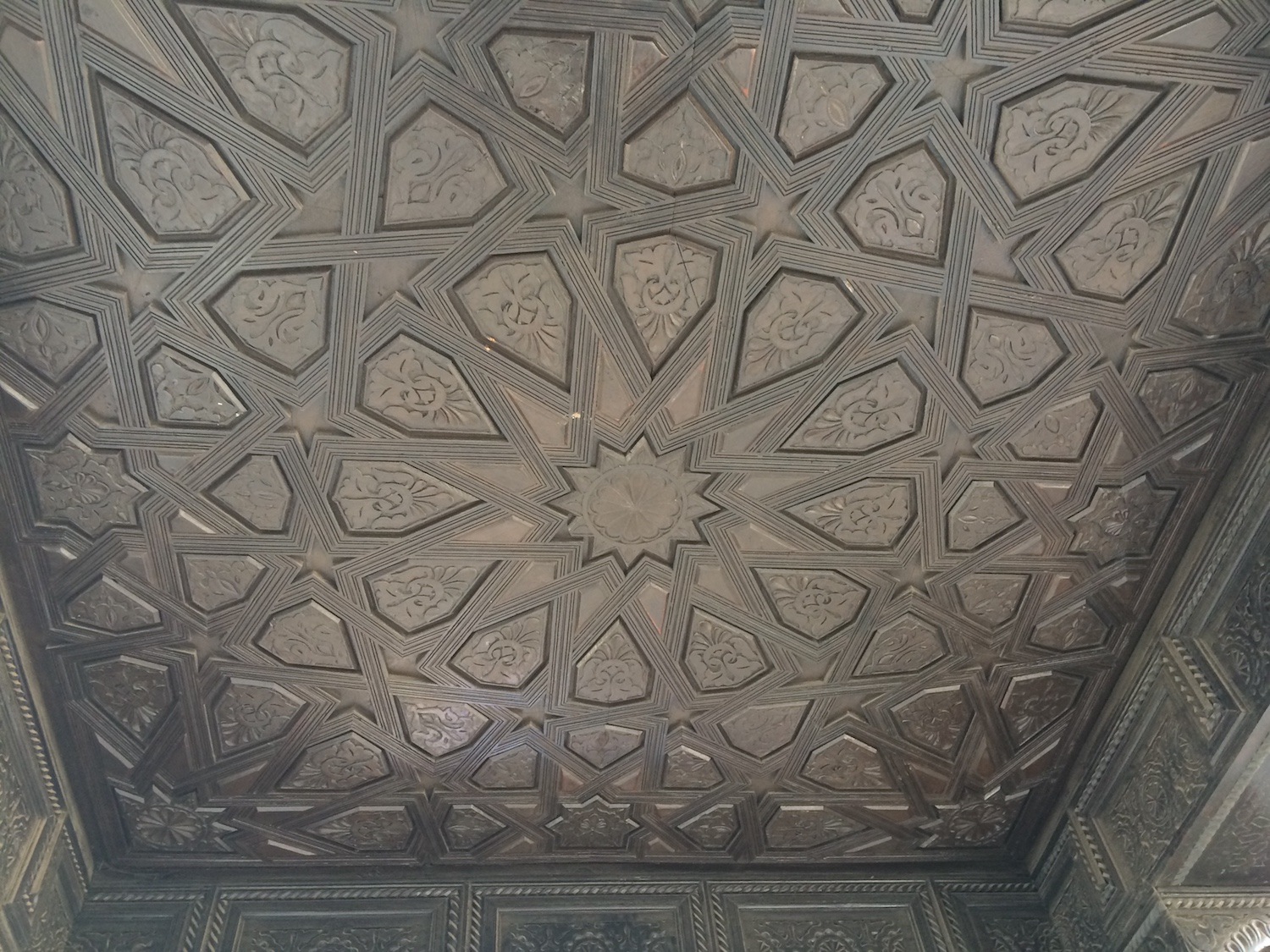 Detail view of the geometric pattern carved into the ceiling