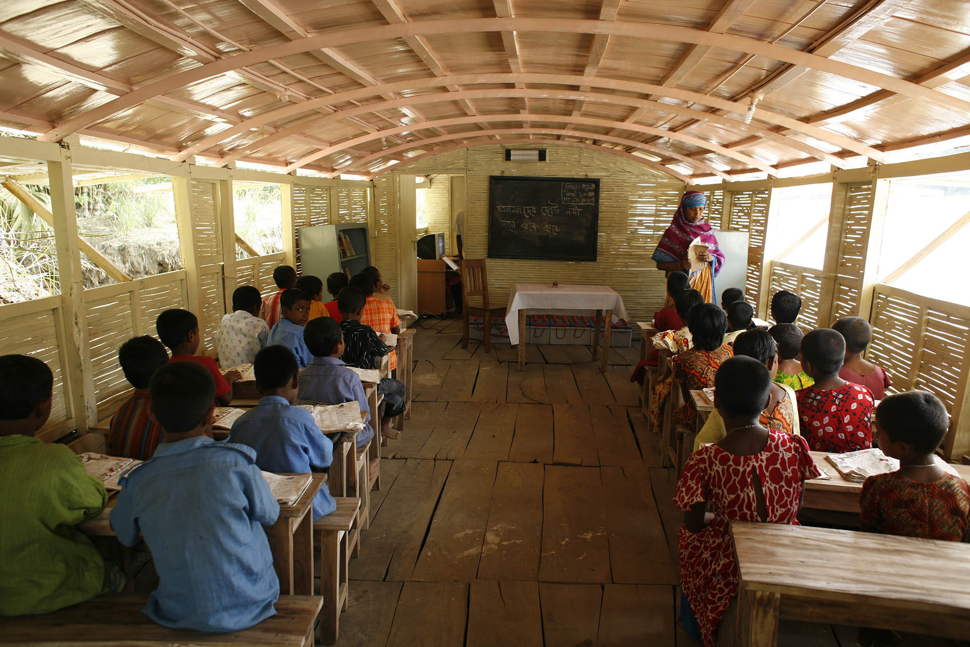 <p>A classroom on a single storied school-boat (interior view from the front door).</p>