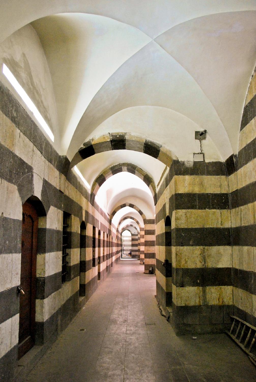 Interior view of a corridor in the upper level containing merchant dormitories