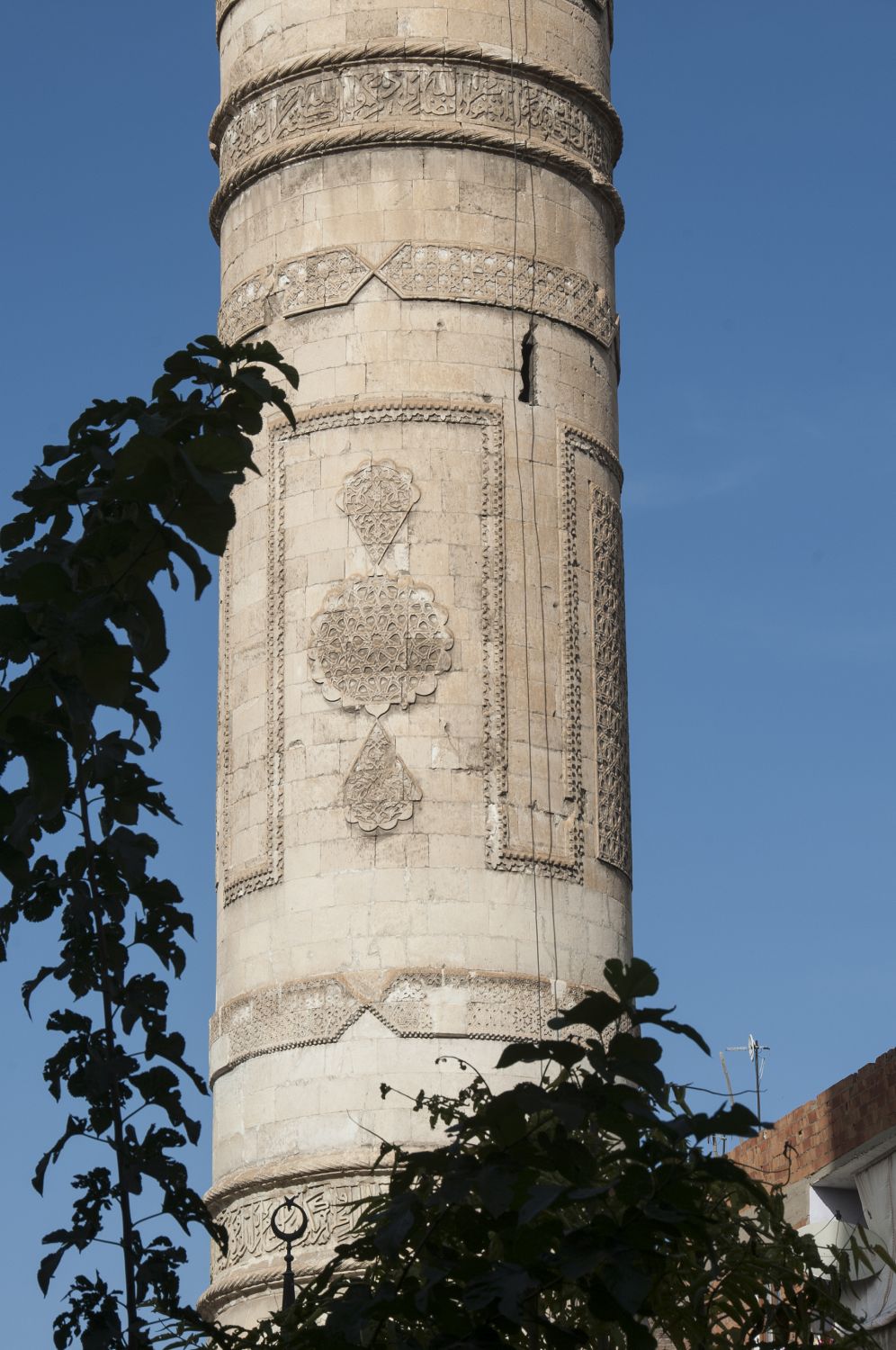 Detail view of minaret shaft showing carved ornament.