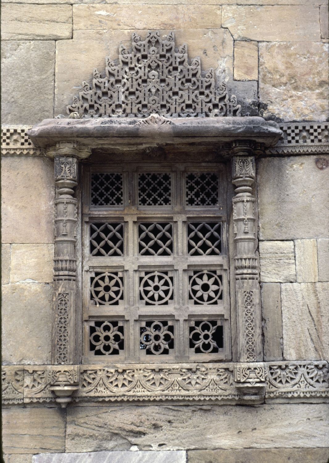 View of window on facade with decorative marble screen (jali).