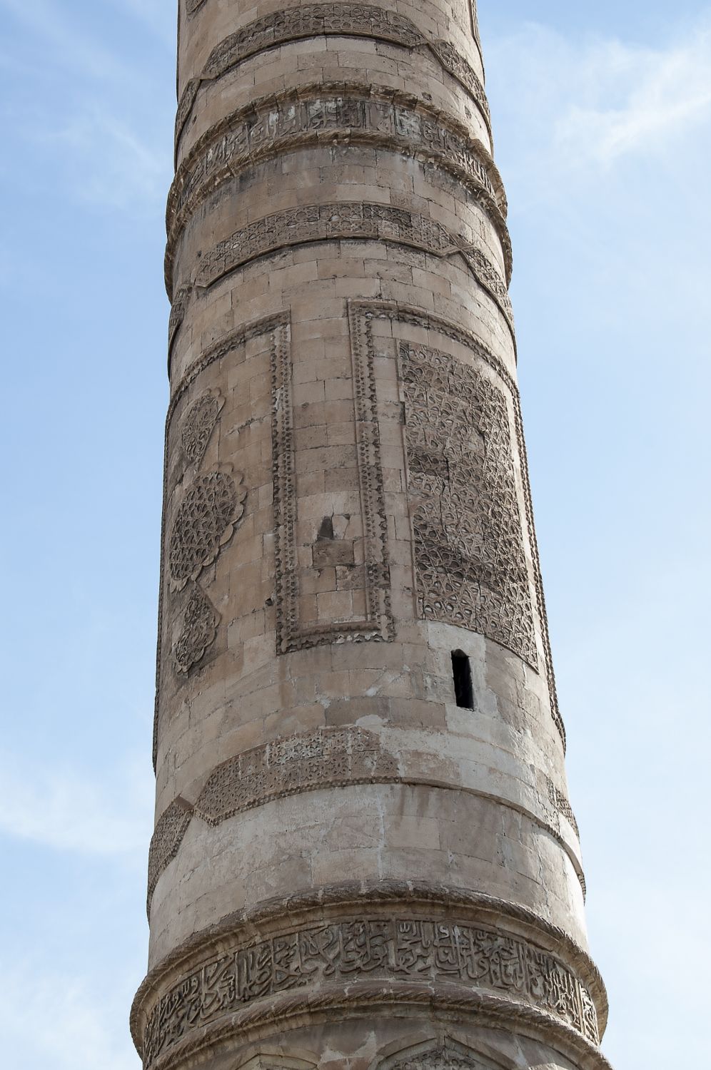 Detail view of minaret shaft showing carved ornament.