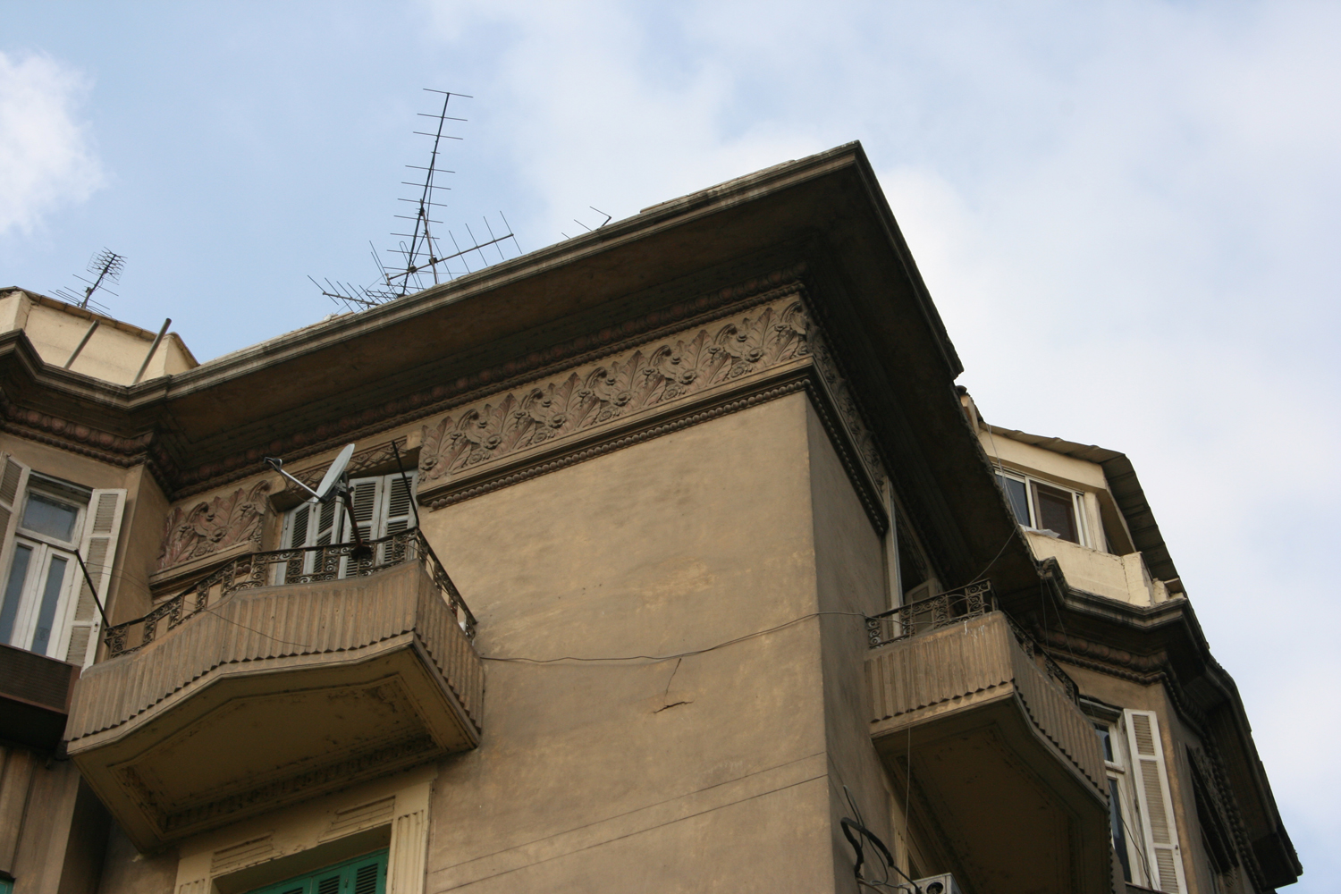 Detail of the facade with a decorative frieze under the cornice